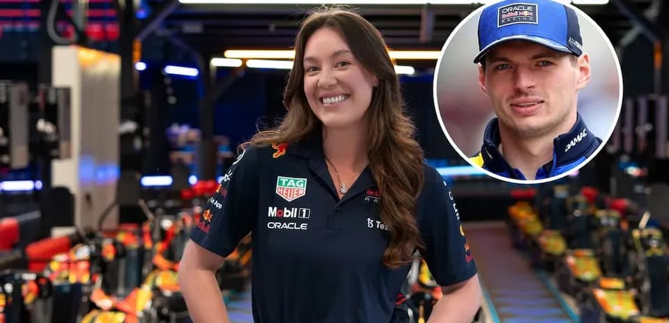 Woman in Red Bull Racing uniform posing confidently