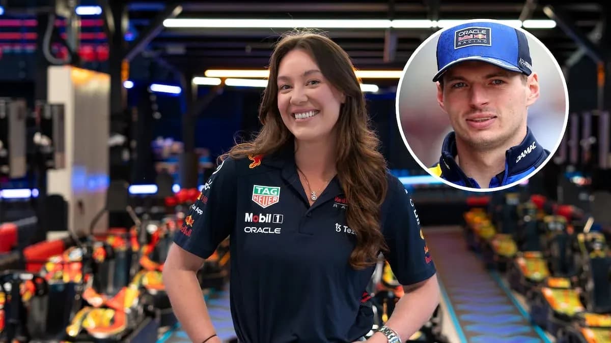 Woman in Red Bull Racing uniform posing confidently