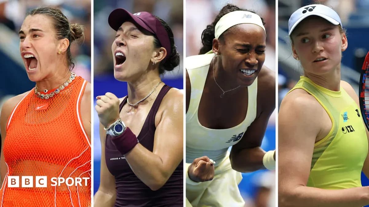 Four female tennis players celebrating on court