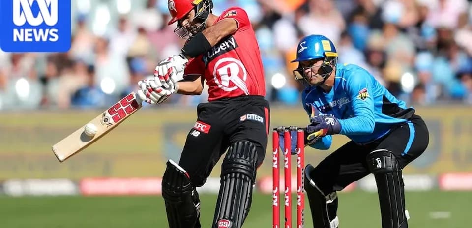 Batter striking ball while wicketkeeper crouches