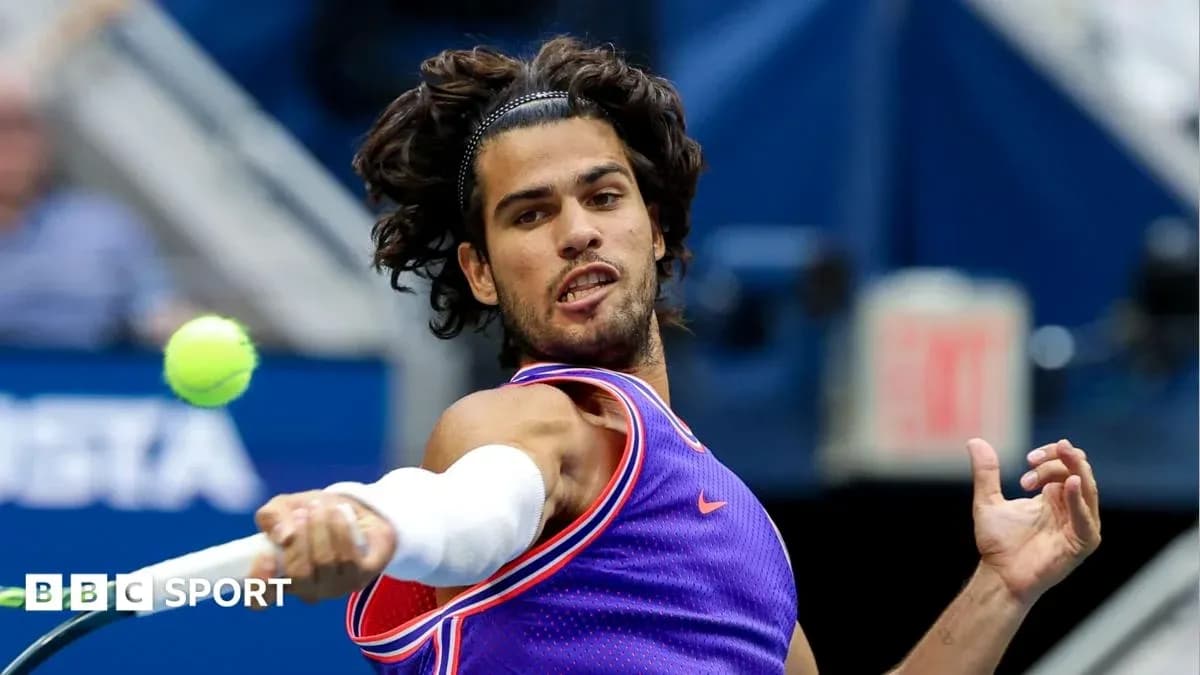 Tennis player hitting a forehand during match