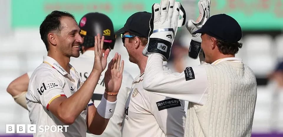 Players celebrating after a successful wicket in cricket