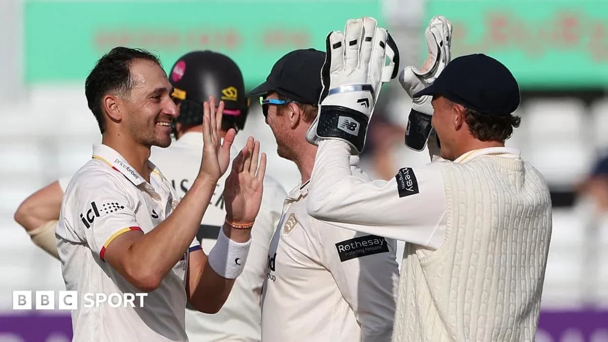 Players celebrating after a successful wicket in cricket