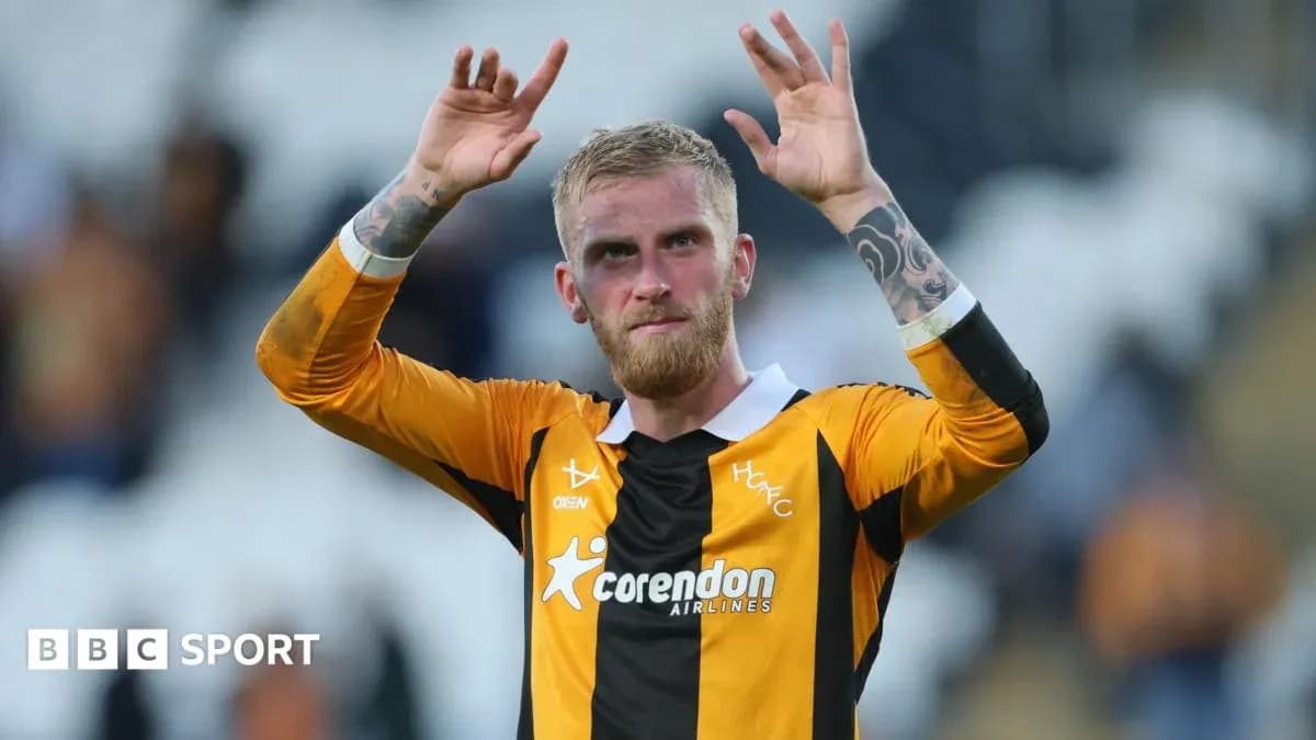 Player waving to fans after the match
