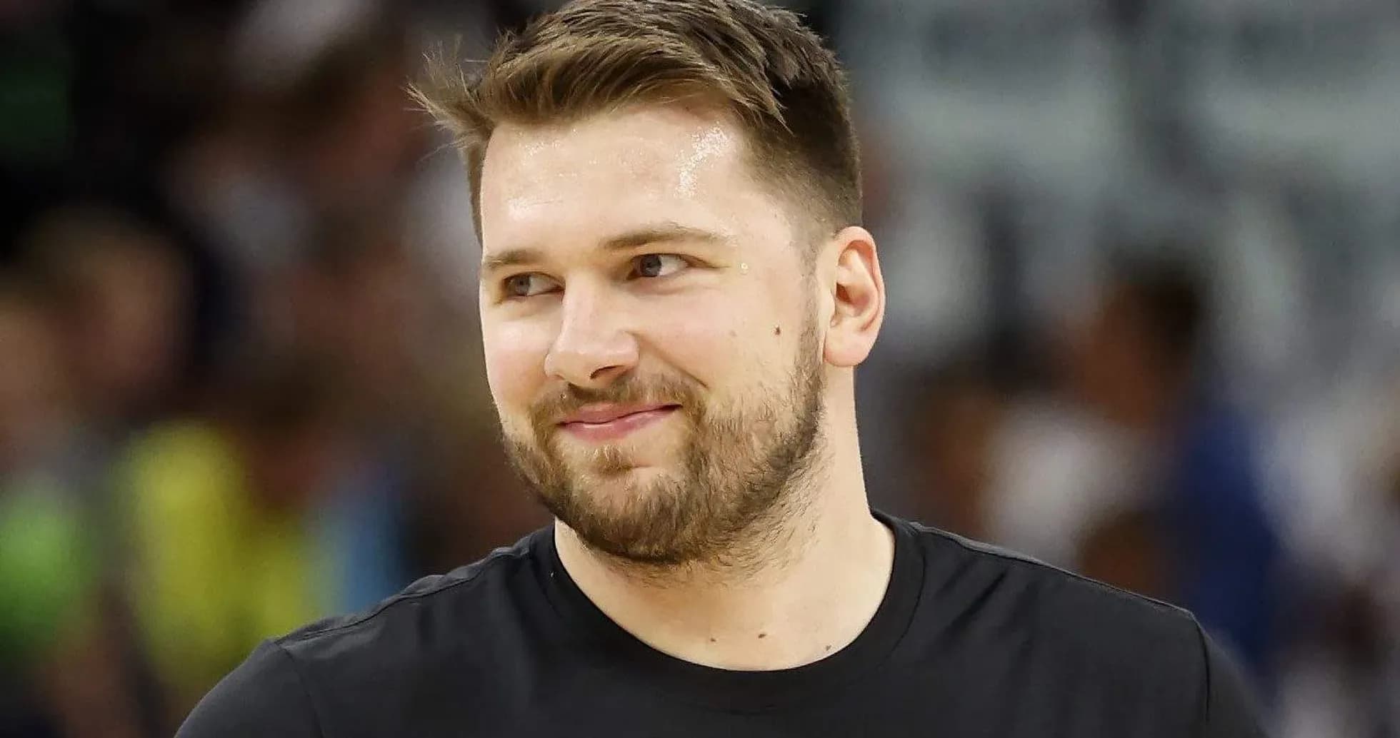 Player smiling during warm-up on basketball court