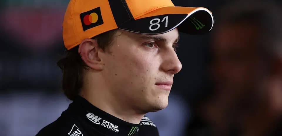 Racing driver wearing cap during press event