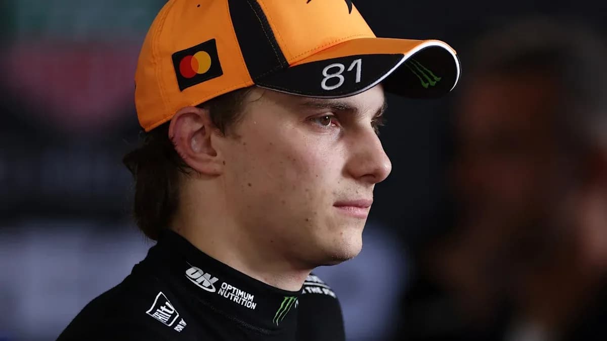 Racing driver wearing cap during press event