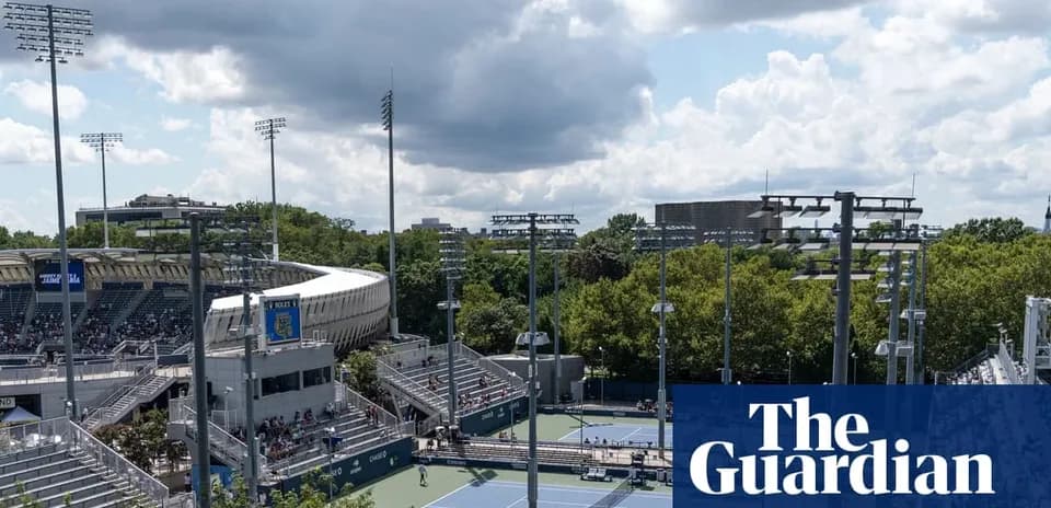 Tennis courts and stadium under cloudy sky