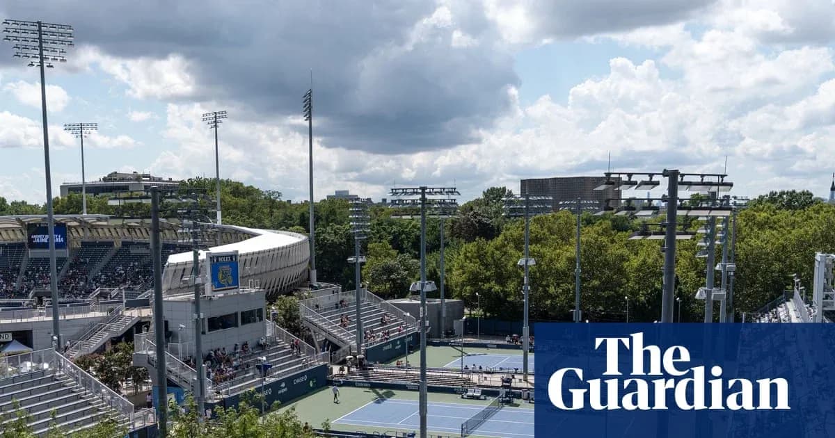 Tennis courts and stadium under cloudy sky