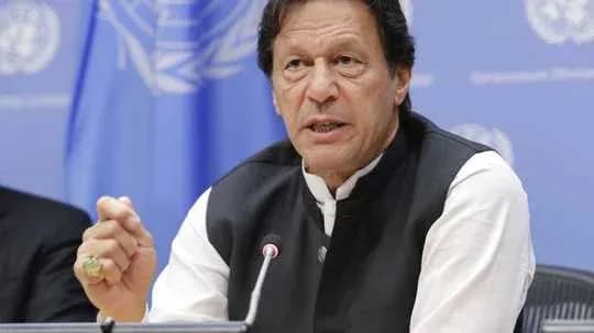 Man speaking at press conference with UN backdrop