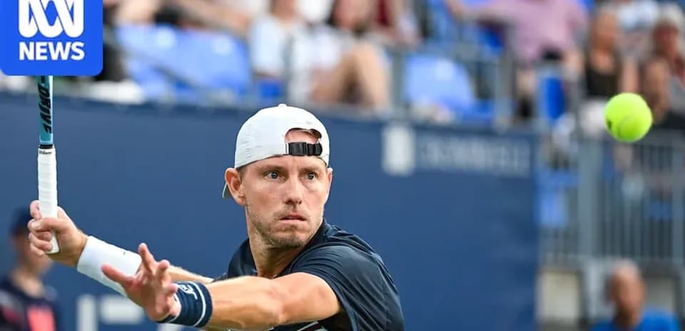 Tennis player hitting a forehand during match