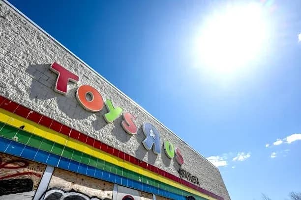 Toys 'R' Us storefront under bright blue sky