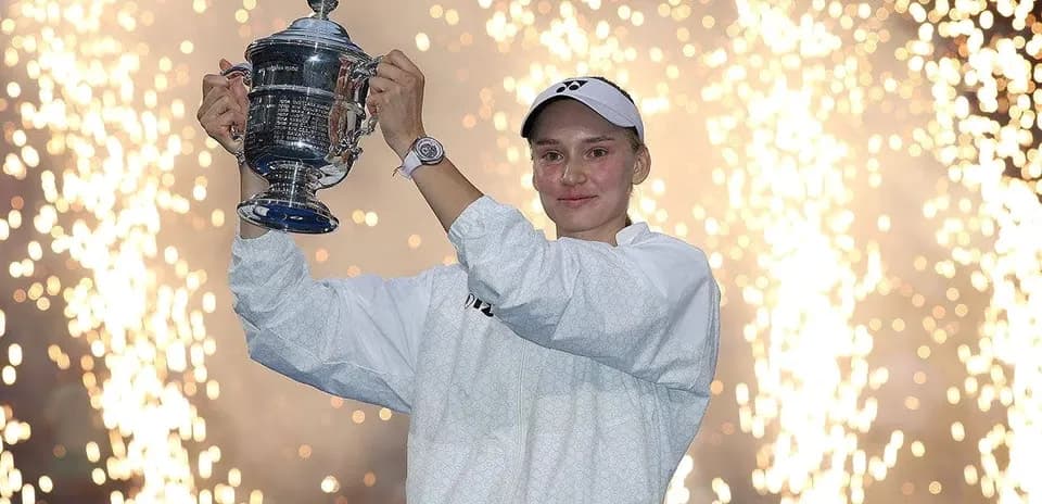 Player holding trophy with fireworks in background
