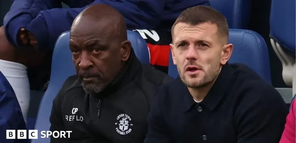 Two men sitting on the bench during a match