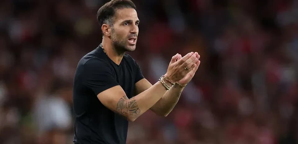Coach giving instructions on the sidelines during match