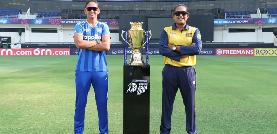 Two cricket captains posing with Asia Cup trophy
