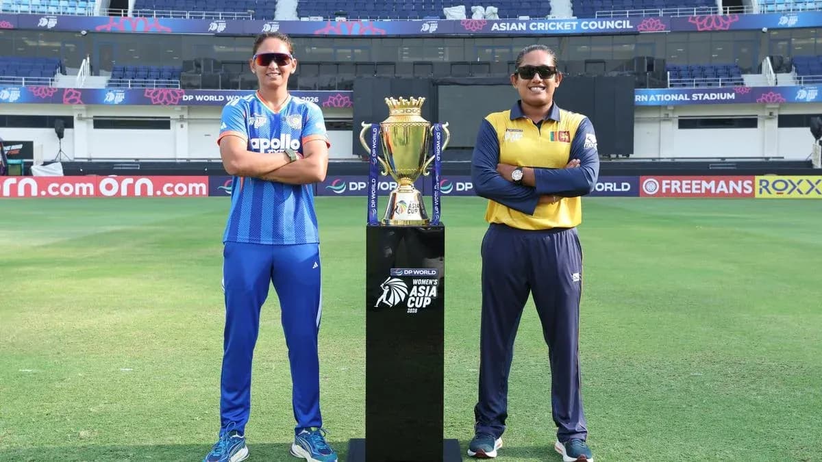 Two cricket captains posing with Asia Cup trophy