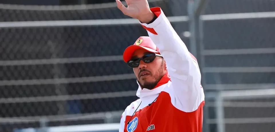 Driver waving during a racing event appearance
