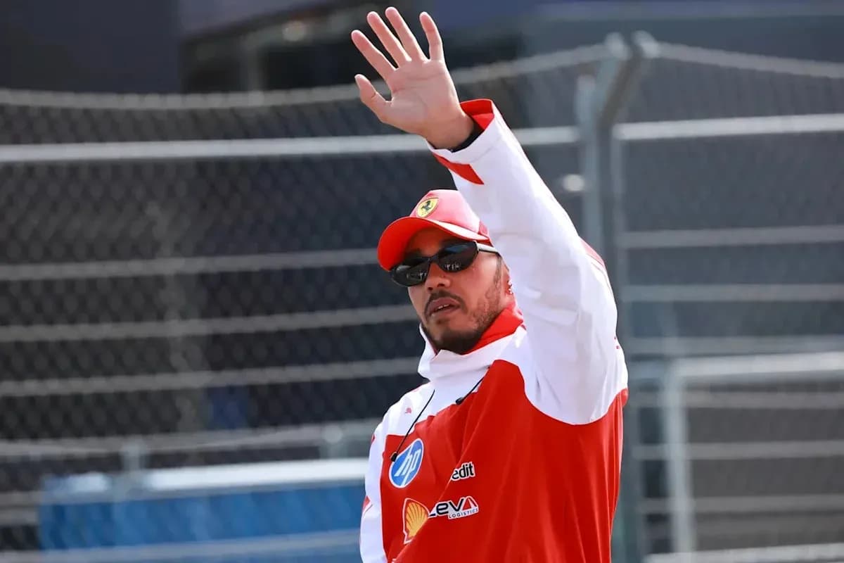 Driver waving during a racing event appearance