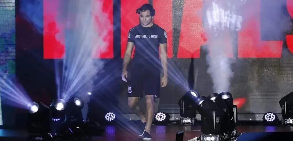 Athlete walking to the finals stage with lights