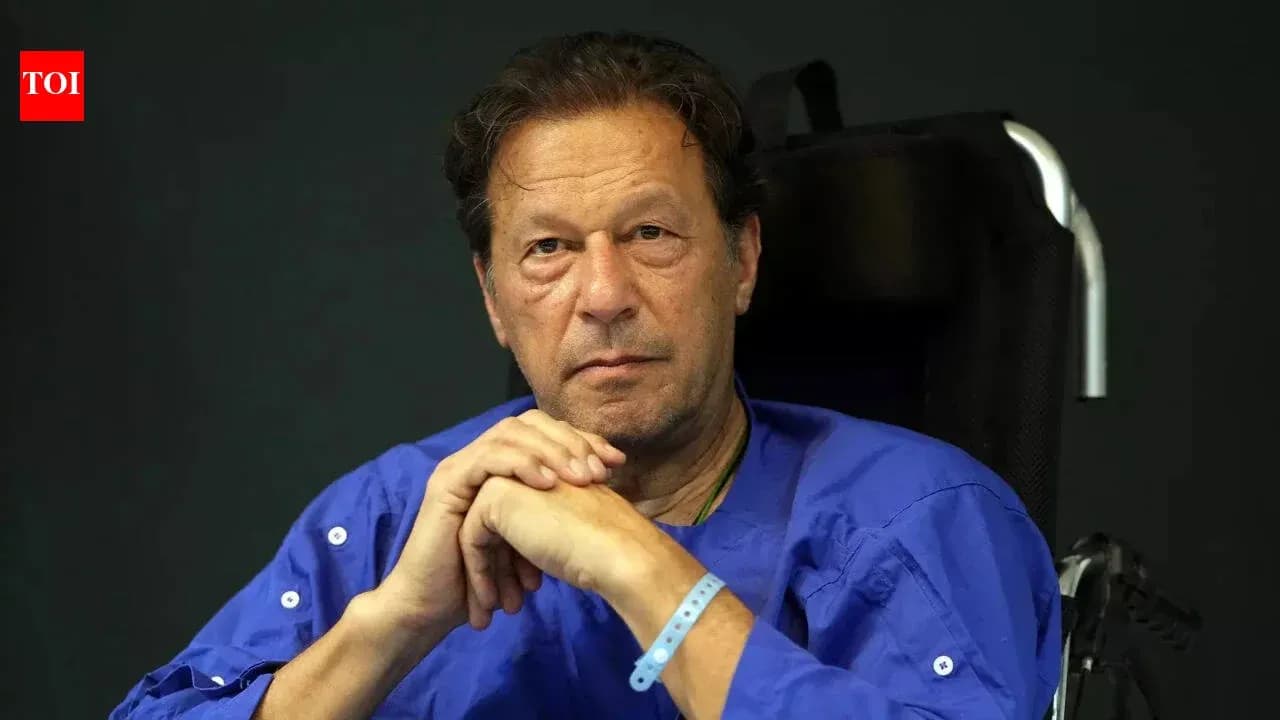 Man sitting in wheelchair, wearing blue shirt