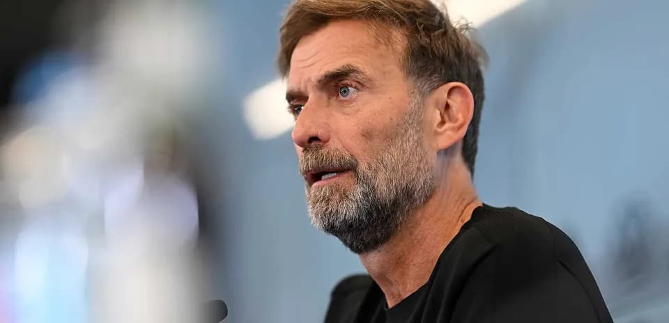 Manager speaking at press conference table