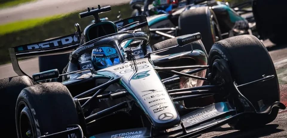 Mercedes F1 car racing on track during competition