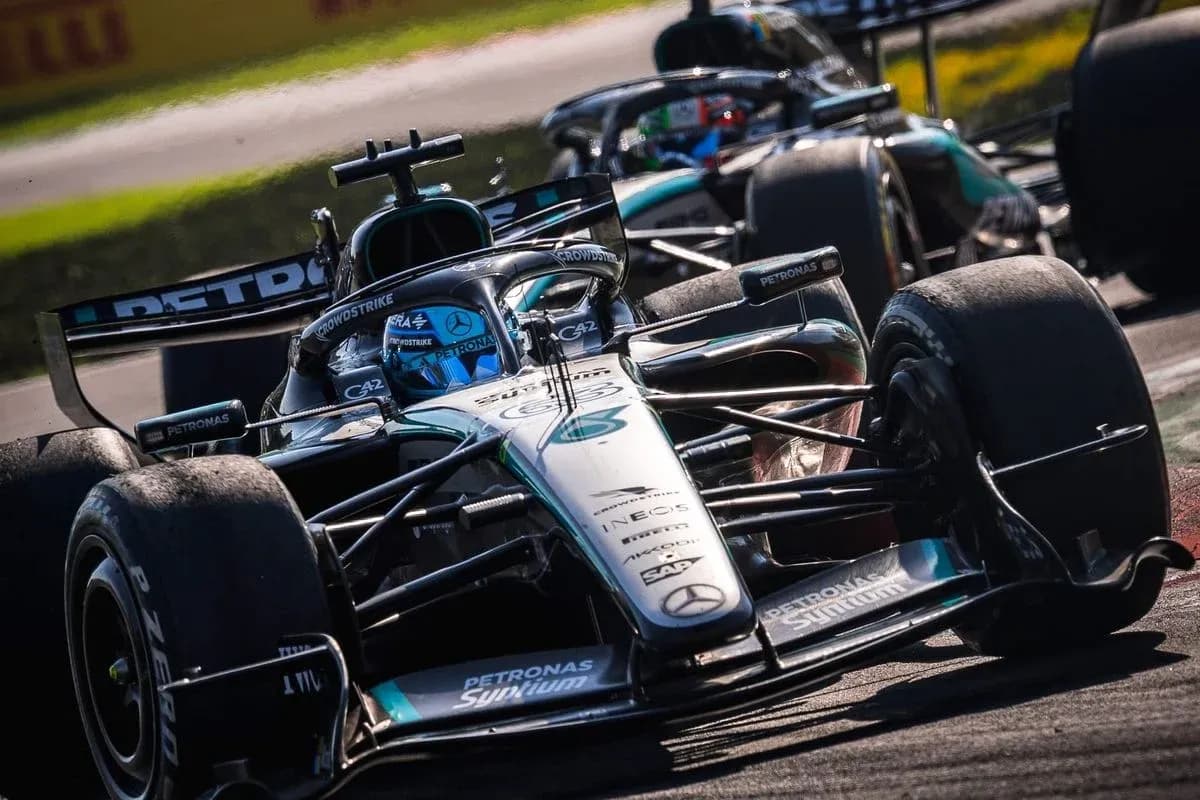 Mercedes F1 car racing on track during competition