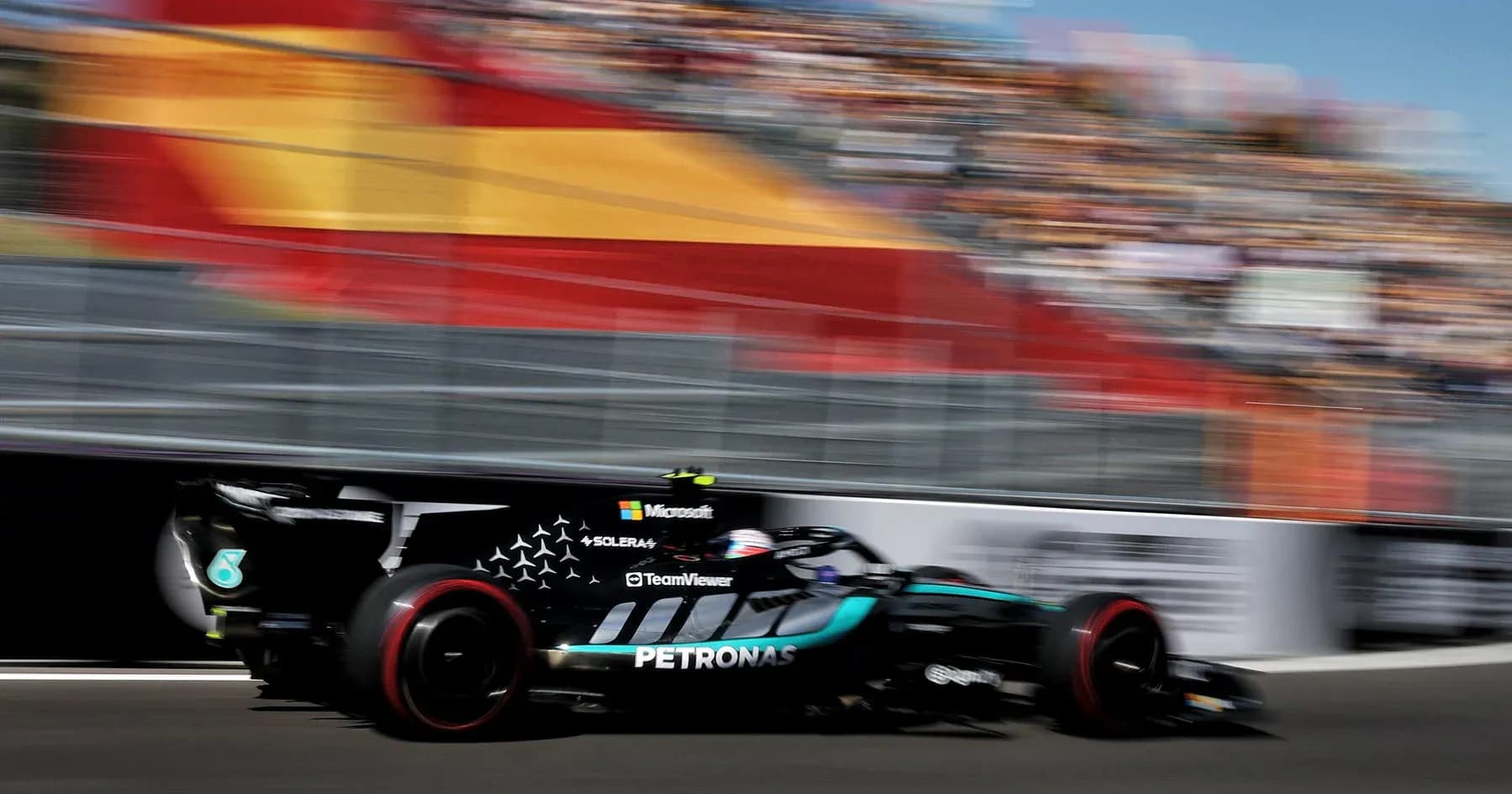 Formula 1 car racing on track with blurred background