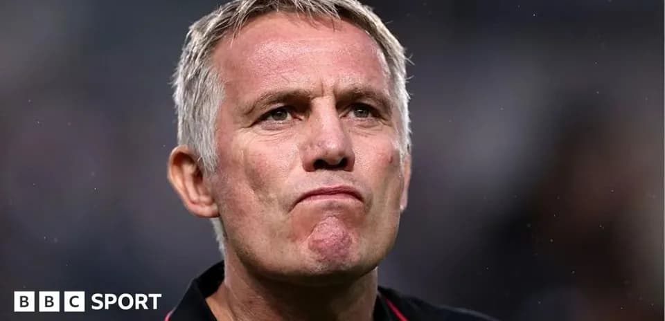 Football manager looking serious on the sidelines