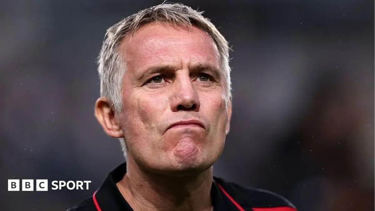 Football manager looking serious on the sidelines