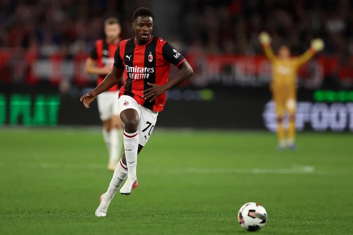 AC Milan player dribbling ball during match