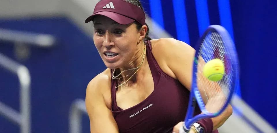 Tennis player hitting a forehand shot during match