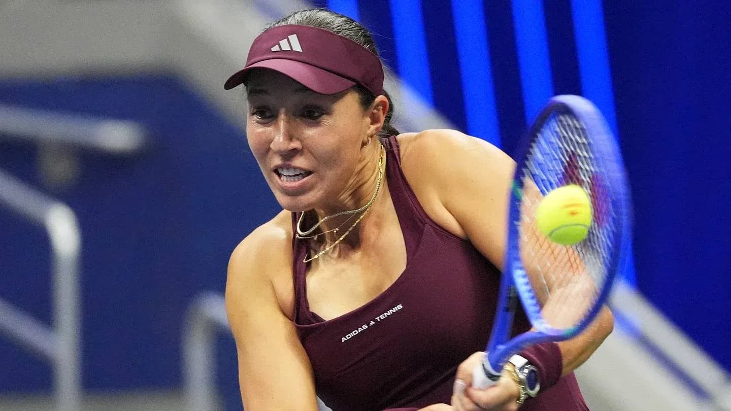 Tennis player hitting a forehand shot during match