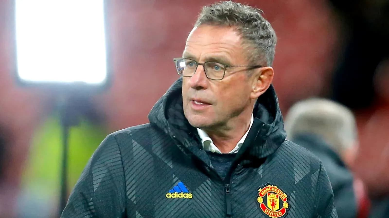 Manager in Manchester United jacket during match