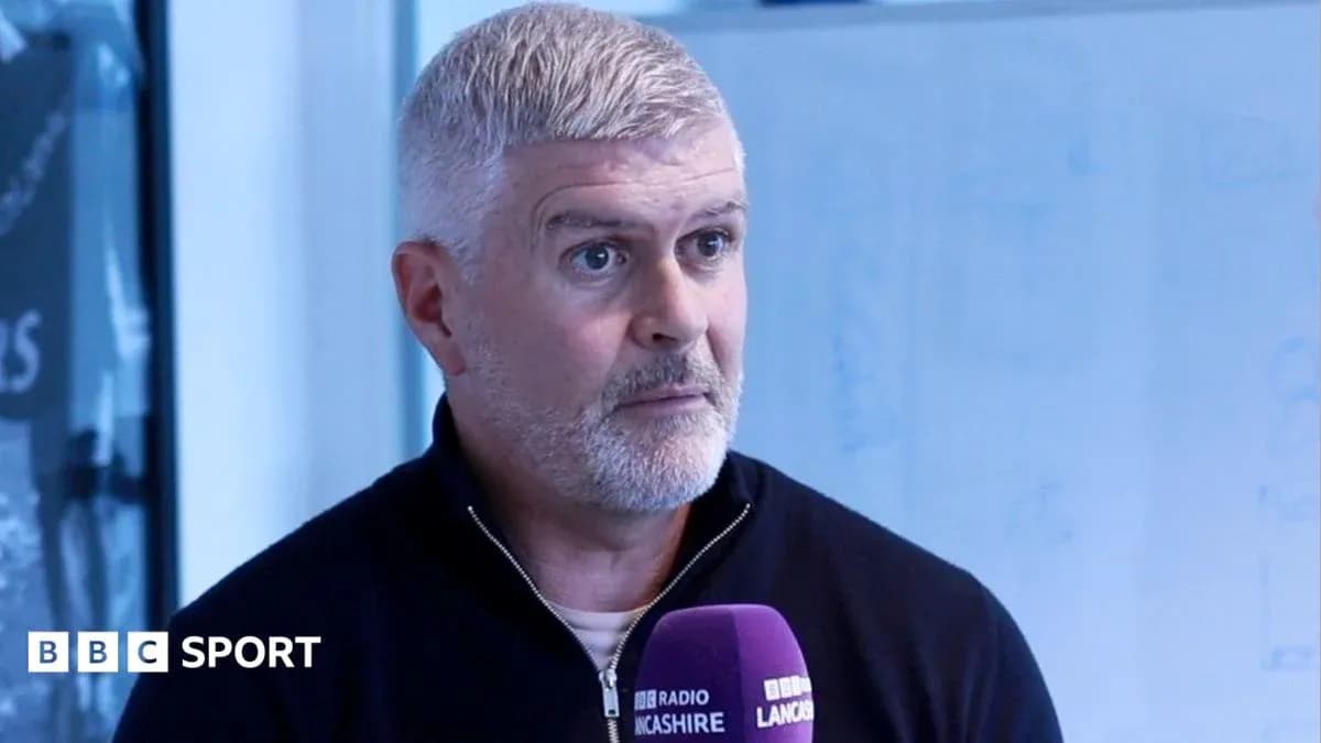 Person speaking into microphone during interview
