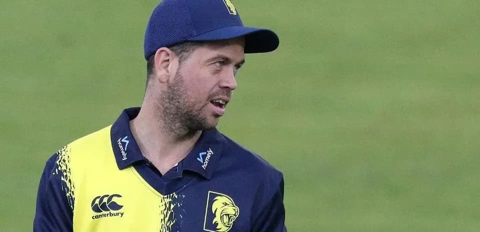 Cricketer wearing team jersey during match