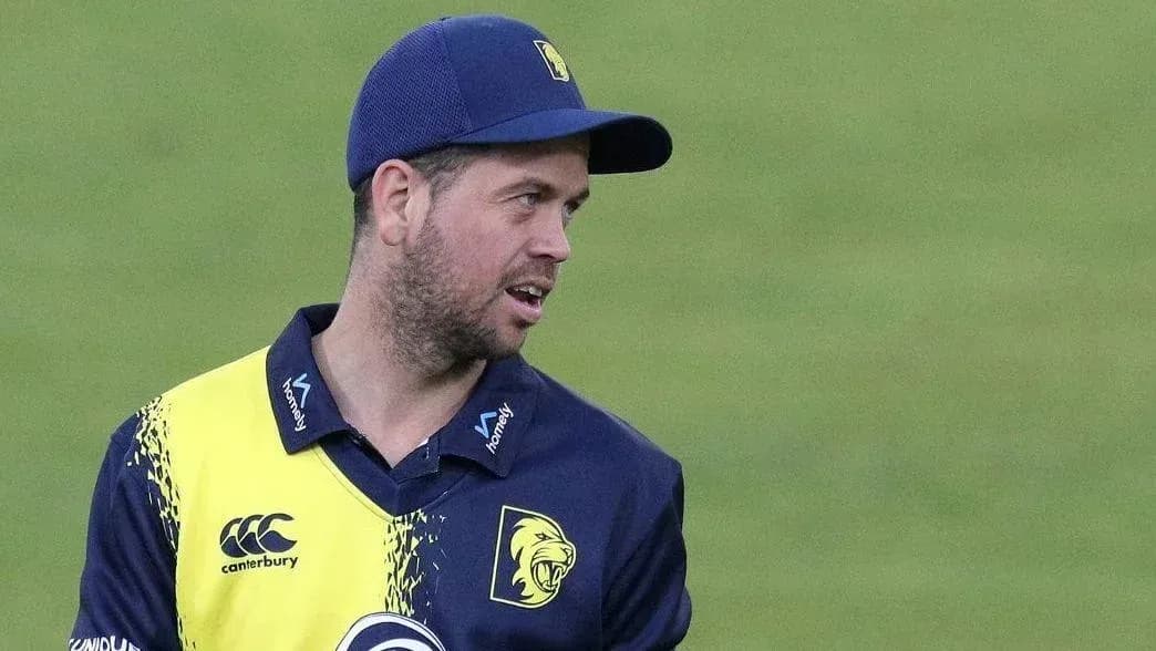 Cricketer wearing team jersey during match