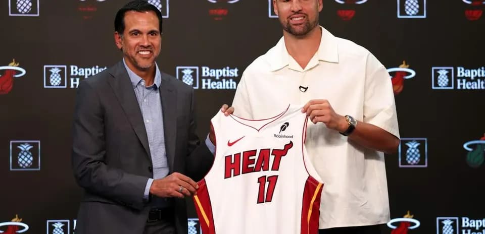 Coach and player unveiling Miami Heat jersey
