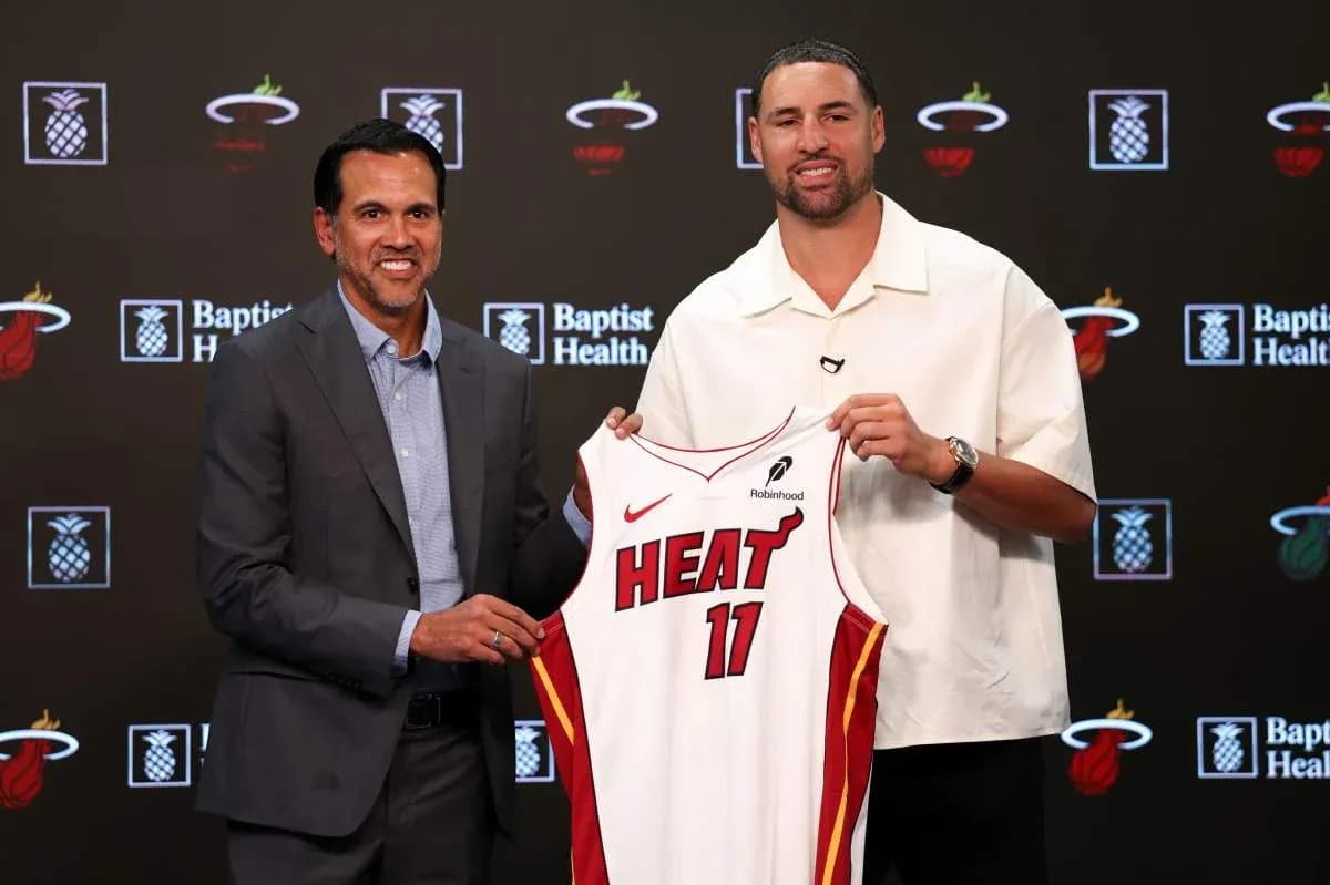 Coach and player unveiling Miami Heat jersey