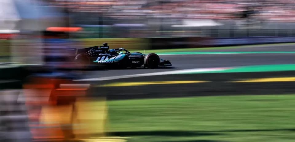 Formula 1 car racing on track with blurred background
