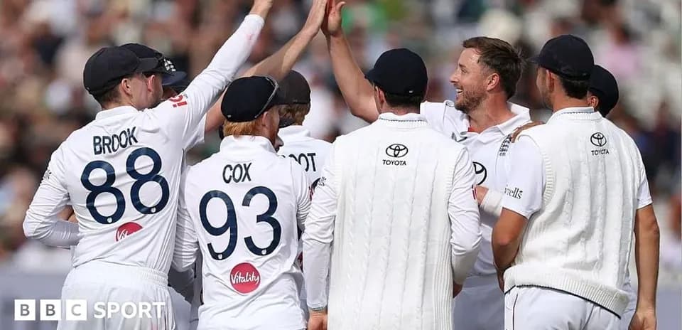 Cricket team celebrating a wicket during match