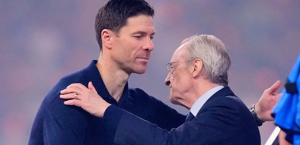 Two men embracing during a formal event