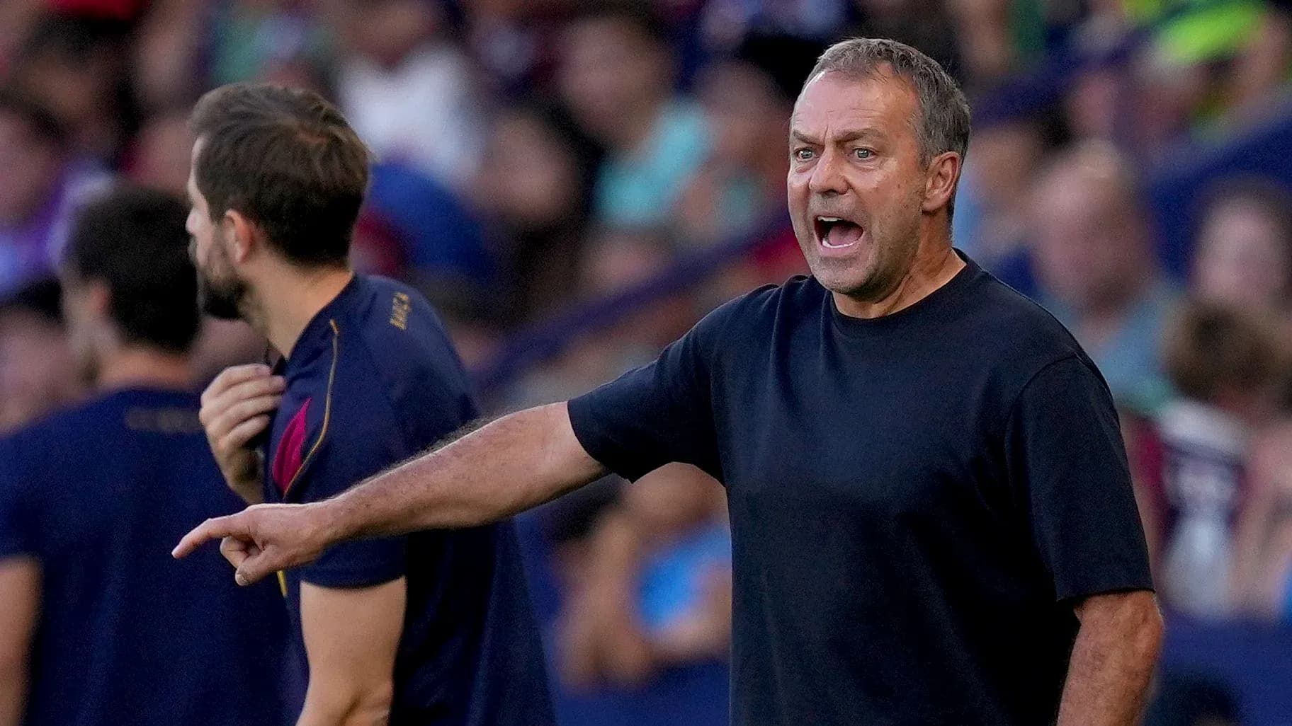 Coach directing players during a match on sidelines