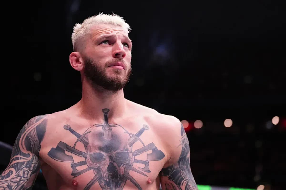 Fighter with tattoos preparing in the ring
