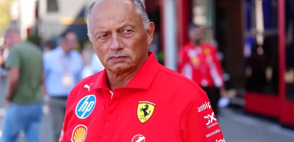 Ferrari team member in red uniform at event
