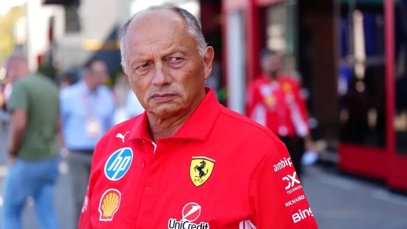 Ferrari team member in red uniform at event