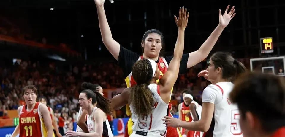 Players competing for the ball during basketball game