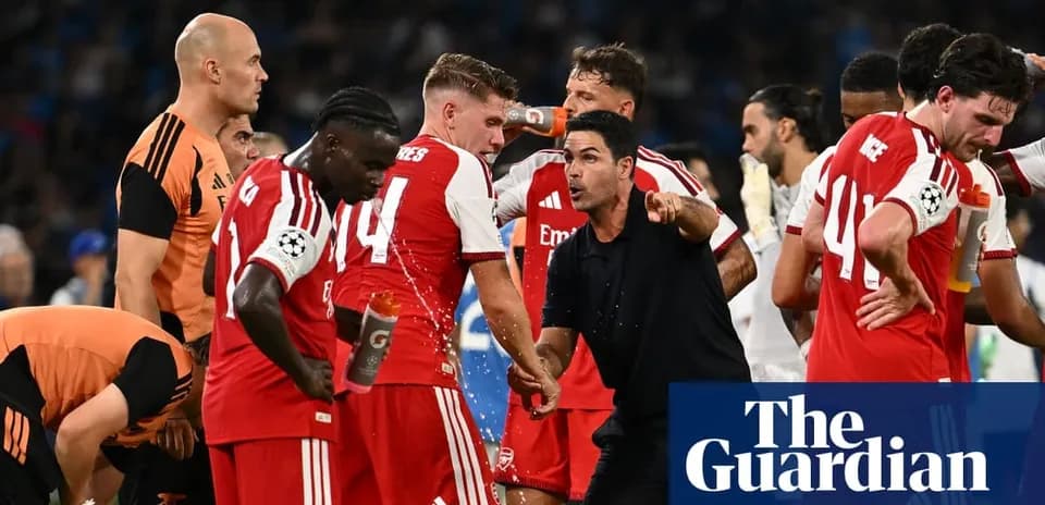 Arsenal players receiving instructions during match break
