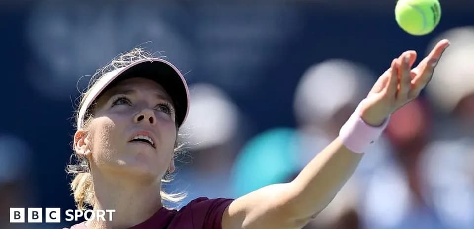Female player serving during a tennis match